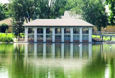 a building sitting on top of a body of water at The Urban Roost I A Rustic City Escape in Denver