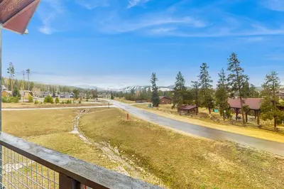 a view of a road from a fence at Modern Mountain View in Fraser