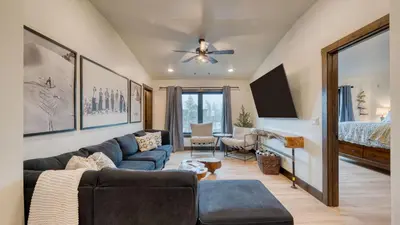 a living room with a couch and a bed at Winterhaven Estate by AvantStay Sleeps 19 Guests Mountain Compound w Views Firepit Hot Tub in Winter Park