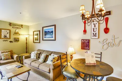 a living room with a couch and a table at On-Site Gondola Access Keystone Ski Condo in Keystone