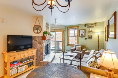 a living room with a tv and a fireplace at On-Site Gondola Access Keystone Ski Condo in Keystone