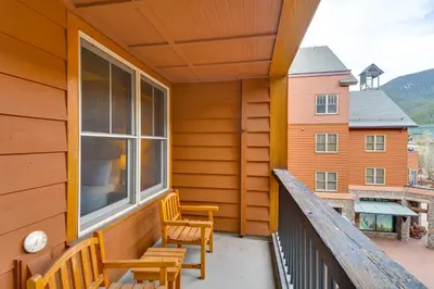 a balcony with two chairs and a window at On-Site Gondola Access Keystone Ski Condo in Keystone