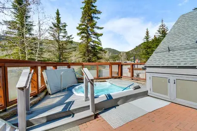 a hot tub on the deck of a house at On-Site Gondola Access Keystone Ski Condo in Keystone