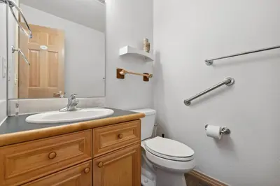 a bathroom with a white toilet and a sink at Charming Frisco Getaway. Close to Main St. Sleeps 8 in Frisco