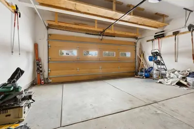 a garage with a pair of garage doors at Charming Frisco Getaway. Close to Main St. Sleeps 8 in Frisco