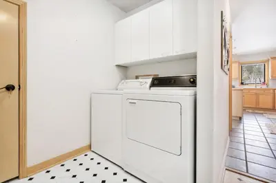 a white washer and dryer in a kitchen at Charming Frisco Getaway. Close to Main St. Sleeps 8 in Frisco