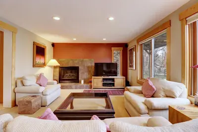 a living room with two couches and a fireplace at 1250 Willow Grove townhouse in Silverthorne