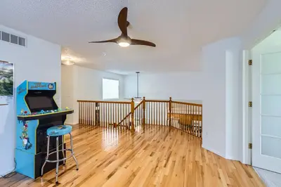 an empty living room with a ceiling fan at Sleeps 9 - Family Retreat - Scenic Trails - Views in Erie