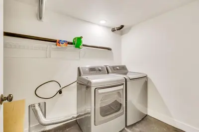 a washer and dryer in a laundry room at Vacation Launch Pad - Great for Groups in Arvada