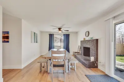 a dining room with a table and a fireplace at Vacation Launch Pad - Great for Groups in Arvada