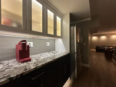 a kitchen with a red appliance on a counter at Entire Private Garden-Level Retreat in Englewood