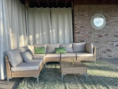 a living room with a couch and a table at Entire Private Garden-Level Retreat in Englewood