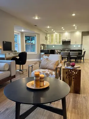 a living room with a table and a couch at Entire Private Garden-Level Retreat in Englewood