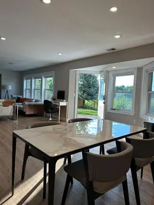 a living room with a table and chairs at Entire Private Garden-Level Retreat in Englewood