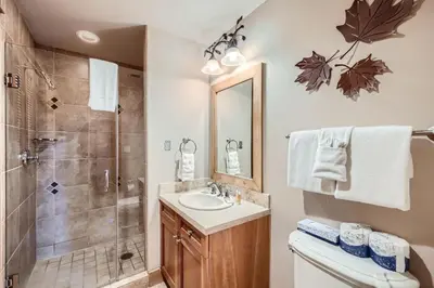 a bathroom with a sink and a shower at Lone Eagle 3013 condo in Keystone