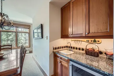 a kitchen with wooden cabinets and a counter top at Lone Eagle 3013 condo in Keystone
