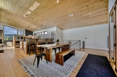a large living room with a wooden ceiling at Caribou Ridge with Hot Tub! Pet Friendly with James Peak Views - Sleeps 10 in Nederland