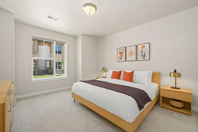 a bedroom with a large bed and a window at Northfield Hideaway, King Suite, EV, Pet-Friendly in Fort Collins