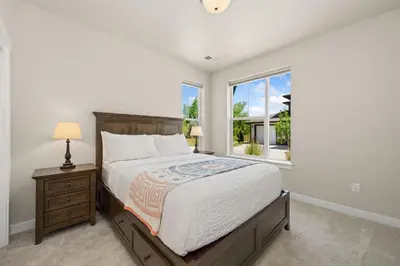 a bedroom with a large bed and a window at Northfield Hideaway, King Suite, EV, Pet-Friendly in Fort Collins