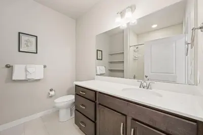 a bathroom with a sink and a toilet at Northfield Hideaway, King Suite, EV, Pet-Friendly in Fort Collins