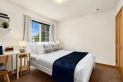 a bedroom with a bed and a desk and a window at Rigden Retreat Garage, Dog Friendly, Near Trails in Fort Collins