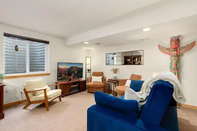 a living room with a blue couch and chairs at Rigden Retreat Garage, Dog Friendly, Near Trails in Fort Collins