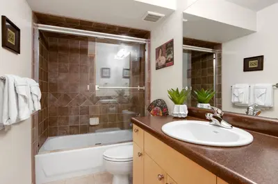 a bathroom with a sink and a tub and a toilet at Rigden Retreat Garage, Dog Friendly, Near Trails in Fort Collins