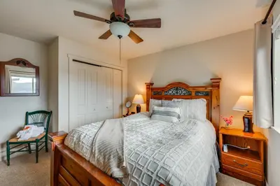 a bedroom with a bed and a ceiling fan at 1 Mi to Dtwn Estes Park Mtn-View Haven! in Estes Park