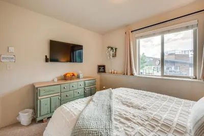 a bedroom with a bed and a window and a dresser at 1 Mi to Dtwn Estes Park Mtn-View Haven! in Estes Park
