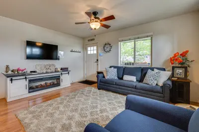 a living room with a couch and a fireplace at 1 Mi to Dtwn Estes Park Mtn-View Haven! in Estes Park