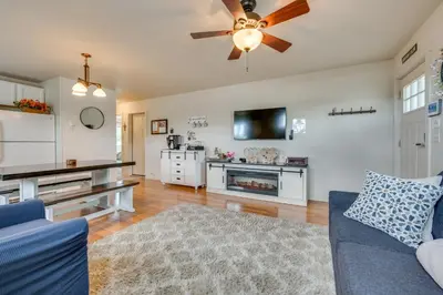 a living room with a couch and a ceiling fan at 1 Mi to Dtwn Estes Park Mtn-View Haven! in Estes Park