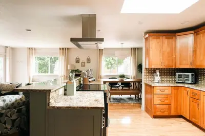 an open kitchen and living room with a counter top at Wellness Retreat - Sauna Cold Plunge & Hot Tub in Broomfield