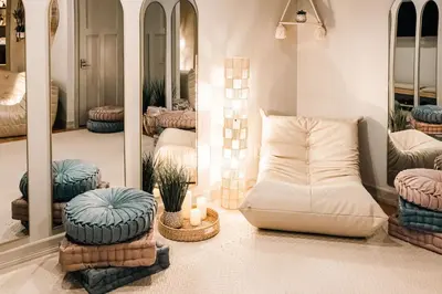 a living room with a white couch and mirrors at Wellness Retreat - Sauna Cold Plunge & Hot Tub in Broomfield