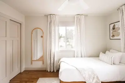 a white bedroom with a bed and a window at Wellness Retreat - Sauna Cold Plunge & Hot Tub in Broomfield