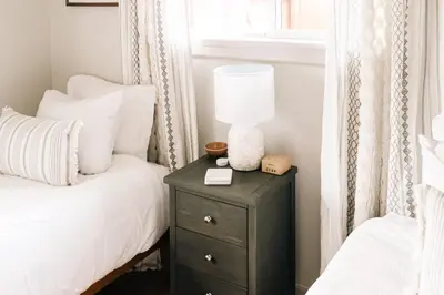 a bedroom with two beds and a night stand with a lamp at Wellness Retreat - Sauna Cold Plunge & Hot Tub in Broomfield
