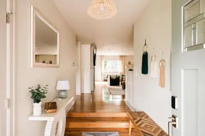 a hallway of a home with wooden floors at Wellness Retreat - Sauna Cold Plunge & Hot Tub in Broomfield