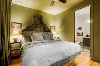 a bedroom with a large bed with a canopy at Million Dollar Rooftop MTN Views -2 King Beds-DT Golden in Golden