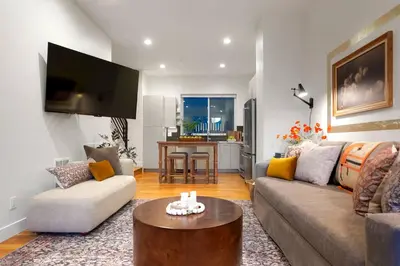 a living room with a couch and a table at Million Dollar Rooftop MTN Views -2 King Beds-DT Golden in Golden