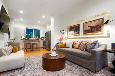 a living room with a couch and a table at Million Dollar Rooftop MTN Views -2 King Beds-DT Golden in Golden