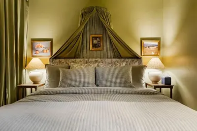 a bedroom with a large bed with a canopy at Million Dollar Rooftop MTN Views -2 King Beds-DT Golden in Golden