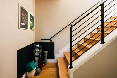 a stairwell with a stair case with a stair railing at Modern Comfort w Mountain Views - Pet-Friendly in Denver