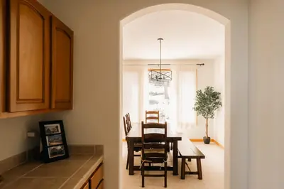 a kitchen and dining room with a table and chairs at Peaceful Getaway with Hot Tub - Views - Evergreen in Evergreen