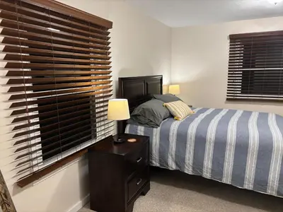 a bedroom with a bed and a window at Peaceful in Evergreen