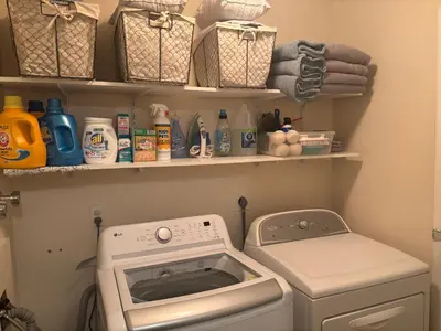 a laundry room with a washing machine and a washer at Peaceful in Evergreen