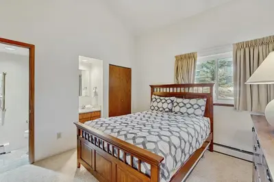 a bedroom with a bed and a large window at Buffalo Ridge 305E in Silverthorne