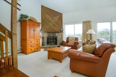 a living room with a couch and a fireplace at Buffalo Ridge 305E in Silverthorne