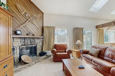 a living room with a couch and a fireplace at Buffalo Ridge 305E in Silverthorne