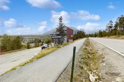 an empty road with a sign on the side of the road at Buffalo Ridge 305E in Silverthorne