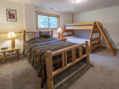 a bedroom with a bunk bed and a ladder at Columbine Cabin, 0019 in Grand Lake