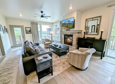 a living room with a couch and a fireplace at Clearwater Lofts Bldg 3 201 by SummitCove Lodging in Keystone